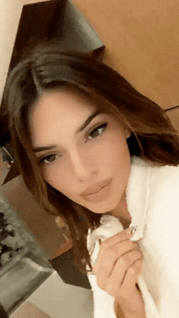 a close up of a woman 's face with brown hair