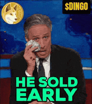 a man in a suit and tie is holding a bunch of money in his hand .