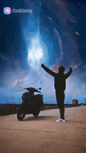 a silhouette of a man standing next to a motorcycle with his arms outstretched in front of a full moon