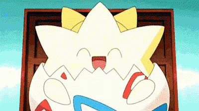 a cartoon pokemon is sitting in a box with its mouth open and smiling .