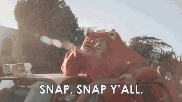 a man in a bear costume is sitting in the back of a car with the words snap snap y ' all .