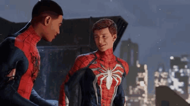 two spider-men are standing next to each other in a video game and talking to each other .