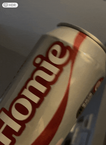 a close up of a coca cola can that says " home "