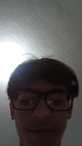 a close up of a person 's face with glasses