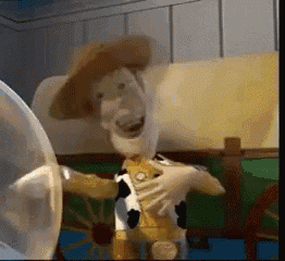 a toy story character named woody is standing in a room