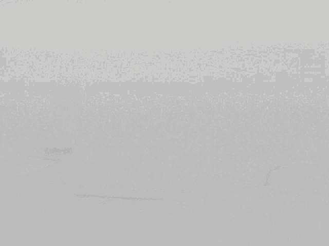 a laptop computer with a blurry face on the screen