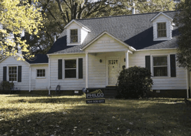 a white house with a philco sign on the front