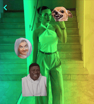 a woman in a green top holds a dog 's head over her face