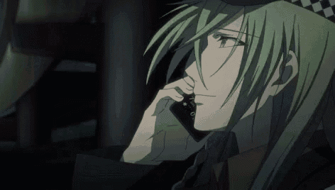 a person with green hair is talking on a cell phone .