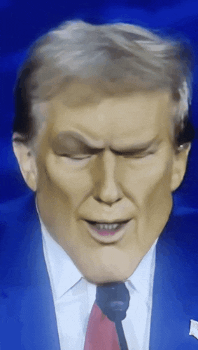 a close up of donald trump 's face with his eyes closed and his mouth open