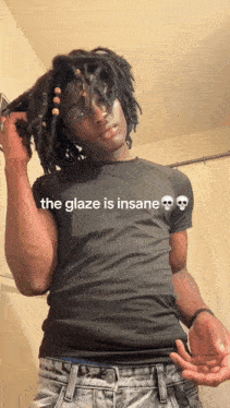 a man with dreadlocks is wearing a black shirt that says the glaze is insane on it