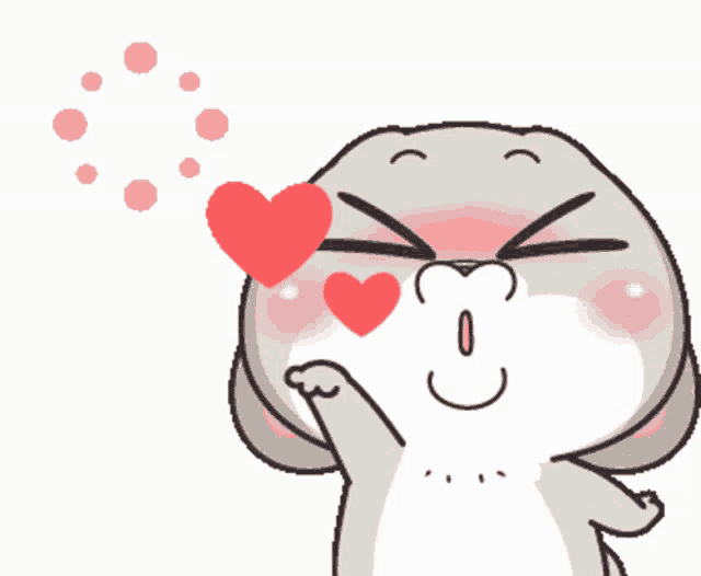 a cartoon rabbit blowing a kiss with a heart in his eyes