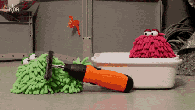 a picture of a mop and a screwdriver with ndr written on the bottom right