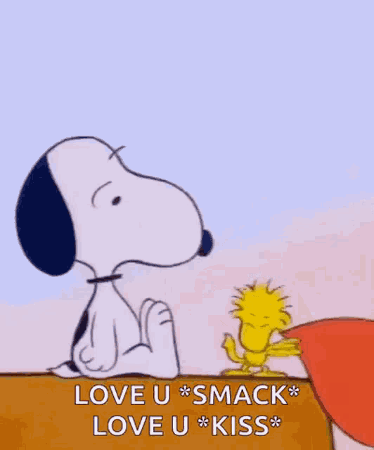 snoopy and woodstock are kissing each other while holding a large heart .