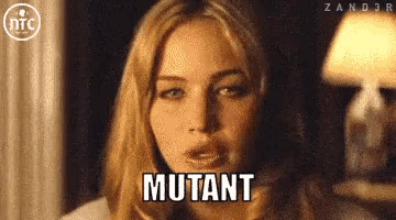 a close up of a woman 's face with the word mutant above her