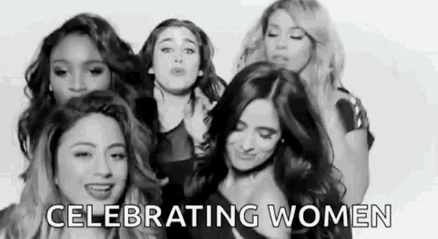a group of women are standing next to each other and celebrating women .