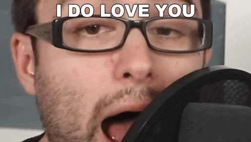 a man with glasses and a beard says i do love you