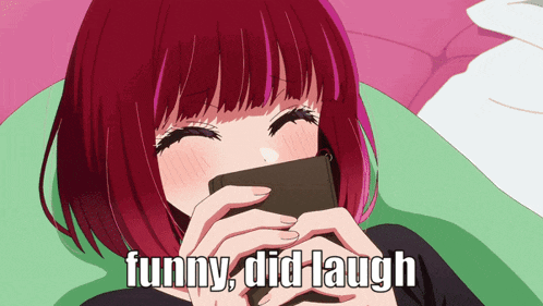 a girl with red hair is laughing while holding a cell phone and the caption funny did laugh