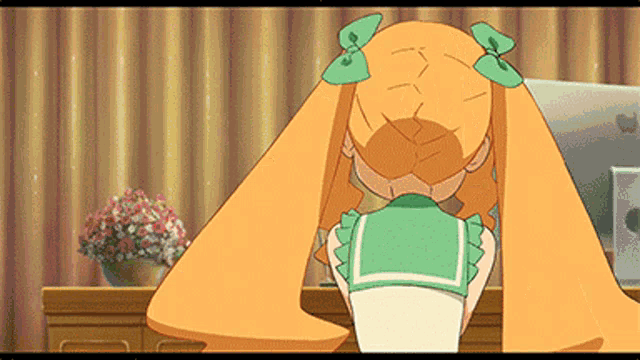 a cartoon girl with orange hair is sitting at a desk in front of a computer