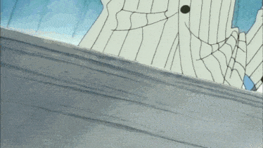 a spider web is visible on a gray surface