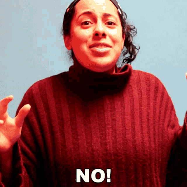 a woman in a red sweater says " no "