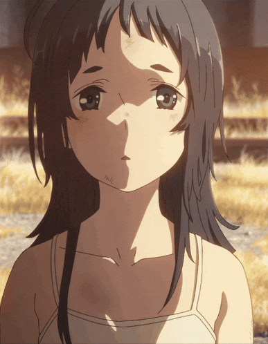 a close up of a girl 's face with the sun shining on it