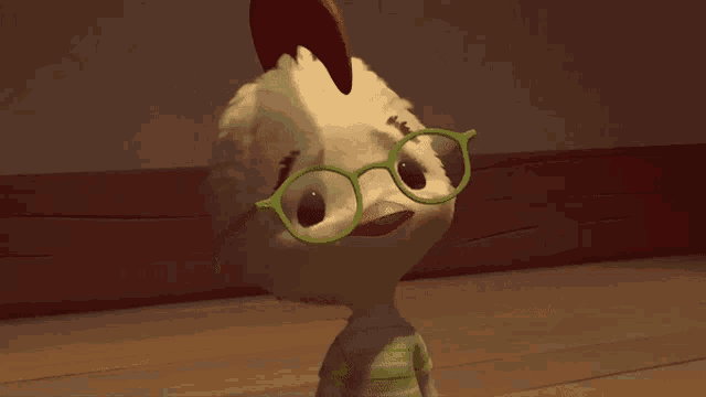 a chicken wearing glasses says " what re we talkin ' about "