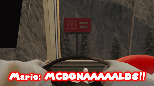 a mcdonald 's sign is behind a steering wheel