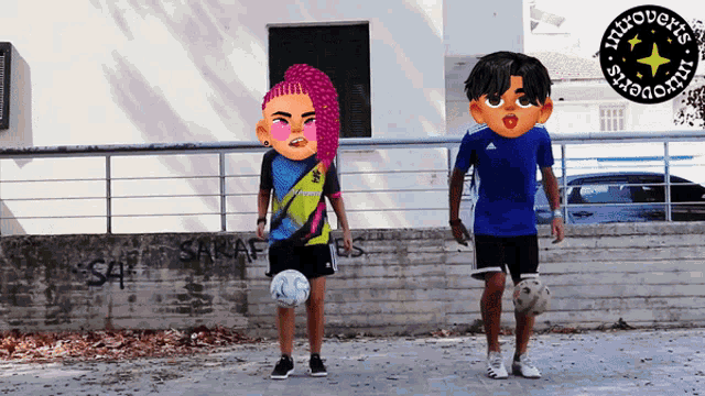 a boy and a girl are playing soccer in front of a sign that says introverts