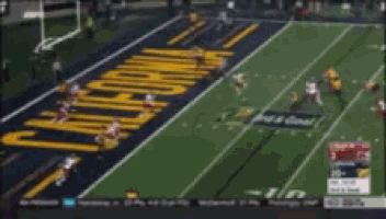 a blurred image of a football field with the word ohio painted in yellow