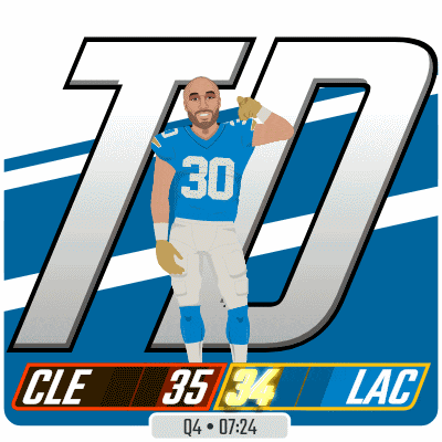 a football player with the number 30 on his jersey is waving
