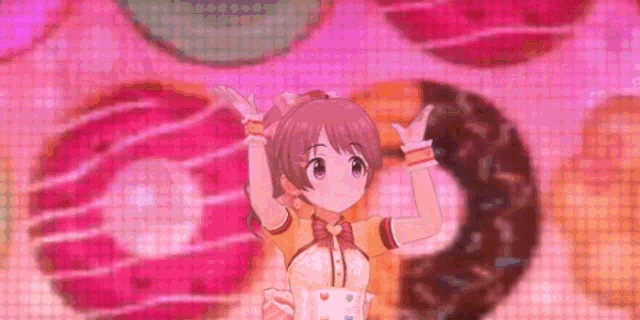 a girl is dancing in front of a donut wall .