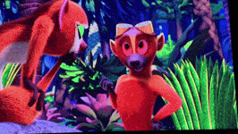 a fox and a lemur are standing next to each other in the jungle