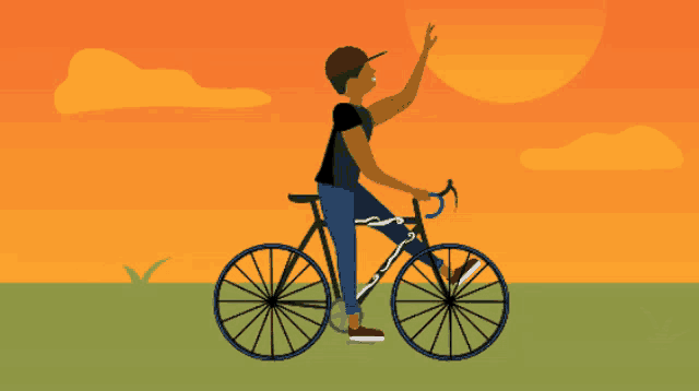 a man is riding a bike with his hand up in the air