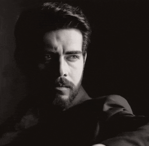 a black and white photo of a man with a beard and a search bar in the corner