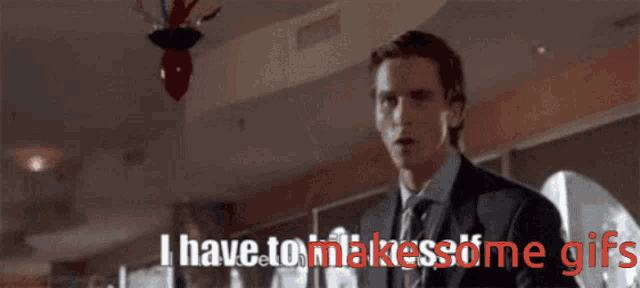 a man in a suit and tie with the words i have to make some gifs behind him