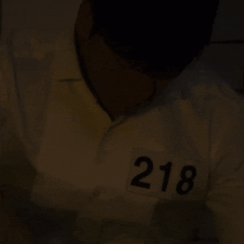 a person 's shirt has a tag that says 218