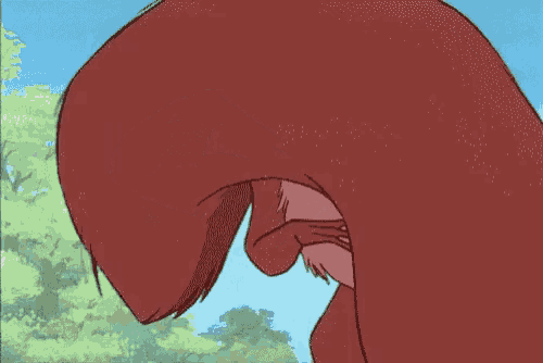 a close up of a cartoon sloth holding its head .