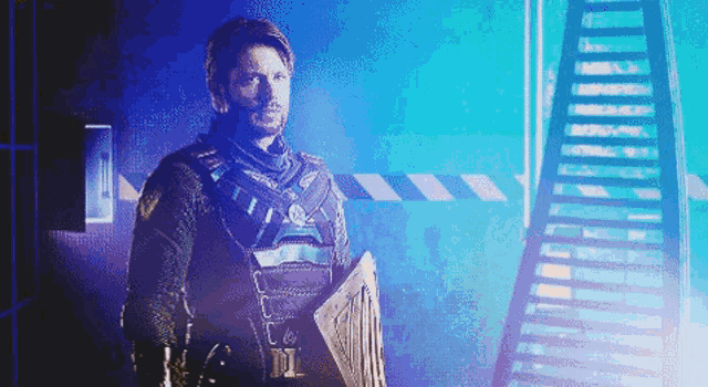 a man in a superhero costume holds a shield in front of a staircase