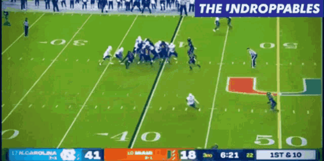 a football game between north carolina and miami is being shown on a television