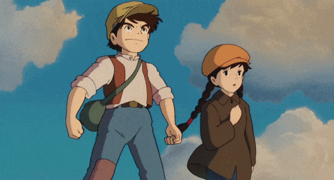 a boy flexes his muscles while a girl looks on