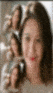 a blurry picture of a woman 's face with red lips