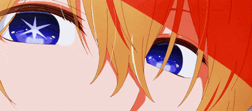 a close up of a person 's blue eye with a star in it