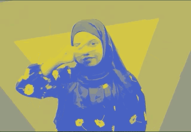 a woman wearing a hijab is smiling in a yellow and blue photo