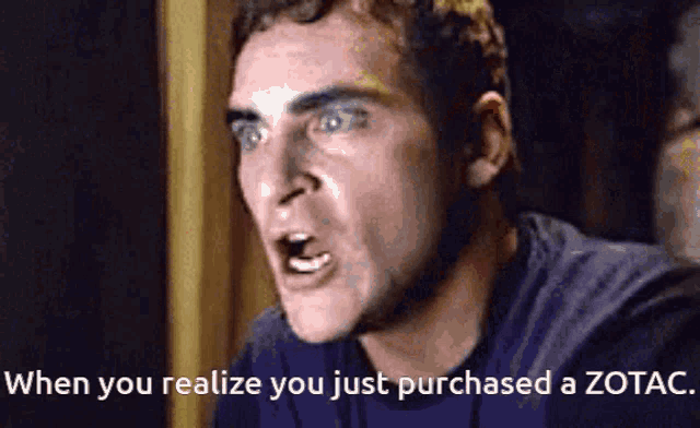 a man is making a funny face with the words when you realize you just purchased a zotac below him