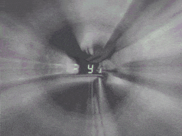 a black and white image of a clock with numbers on it