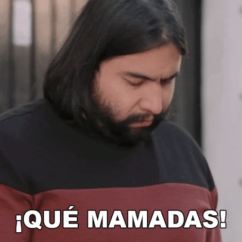 a man with long hair and a beard says iqué mamadas