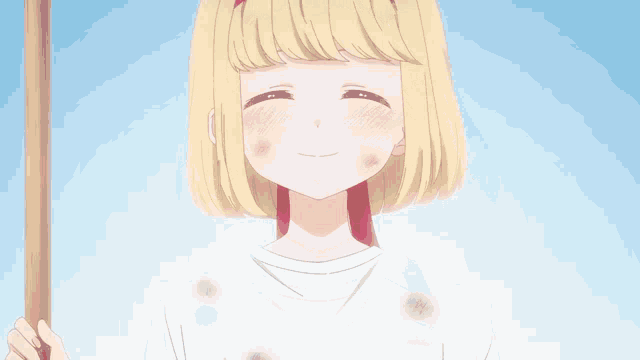 a blonde anime girl with a red headband is smiling