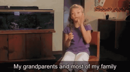 a little girl sitting in a chair with the words " my grandparents and most of my family " written below her