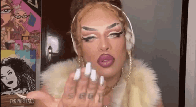 a drag queen is wearing headphones and a fur coat